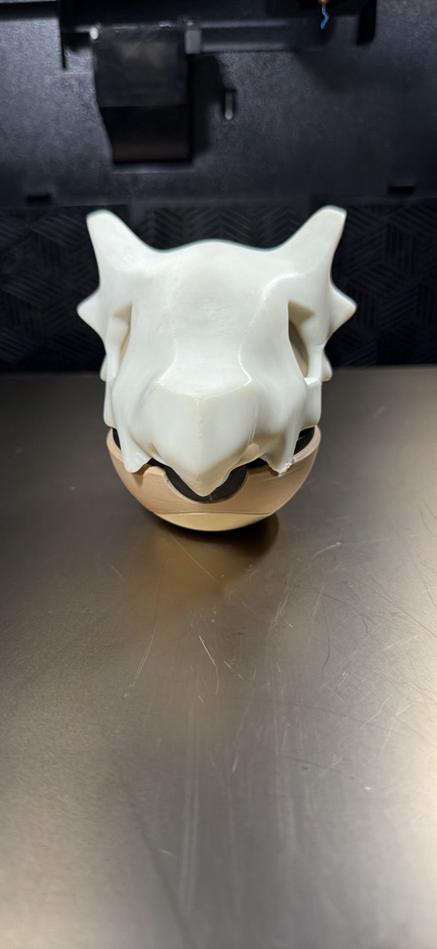 Tan and white 3D printed display ball with large bone helmet design by MHDesigns LLC