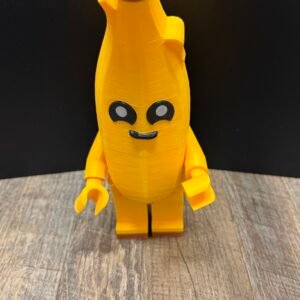 Yellow 3D printed banana character figure standing